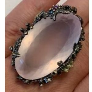 A MASSIVE rose quartz ring